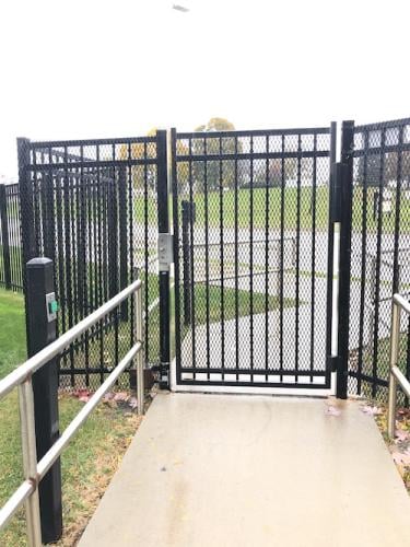 Black Expanded Metal on Commercial Black Picket Gate and Adjacent Fence