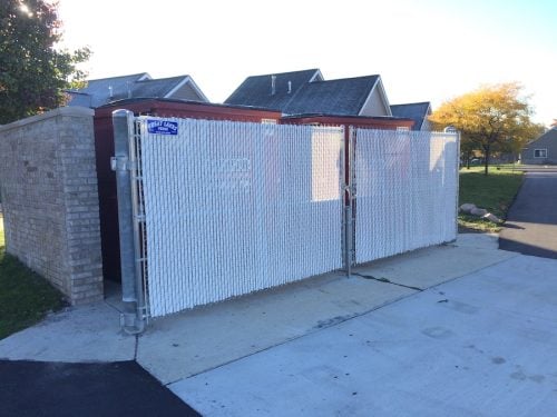 Chain Link Dumpster Gates With Winged White Slats