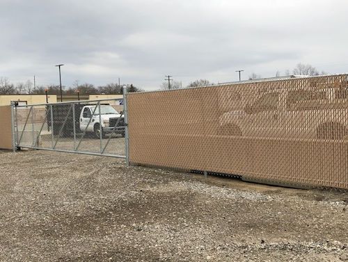 Commercial Chain Link Fence with Bottom Locking Beige Slats And Cantilever Slide Gate With Nylon Rollers